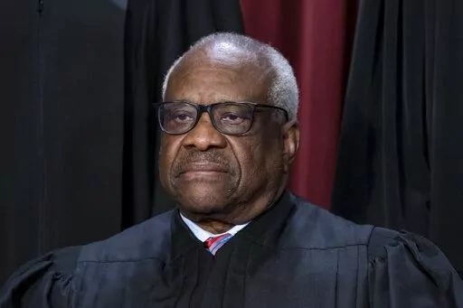 Associate Justice Clarence Thomas joins other members of the Supreme Court as they pose for a new group portrait, at the Supreme Court building in Washington, Oct. 7, 2022. Lawyers who aided former President Donald Trump's efforts to overturn the results of the 2020 election regarded an appeal to Thomas as a "key" to their success. (AP Photo/J. Scott Applewhite, File)