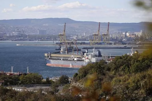 An oil tanker is moored at the Sheskharis complex, part of Chernomortransneft JSC, a subsidiary of Transneft PJSC, in Novorossiysk, Russia, on Oct. 11, 2022, one of the largest facilities for oil and petroleum products in southern Russia. For months after Ukraine's Western allies limited sales of Russian oil to $60 per barrel, the price cap was still largely symbolic. Most of Moscow's crude — its main moneymaker — cost less than that.(AP Photo, File)