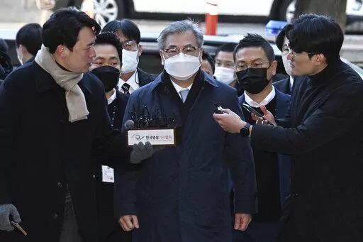Former South Korean National Security Director Suh Hoon, center, arrives at the Seoul Central District Court in Seoul, South Korea, Friday, Dec. 2, 2022. South Korean prosecutors arrested the country’s former national security director on Saturday over suspicions that he engaged in a cover-up to hide details and distort the circumstances surrounding North Korea’s killing of a South Korean fisheries official near the rivals’ sea boundary in 2020. (Han Sang-kyun/Yonhap via AP)
