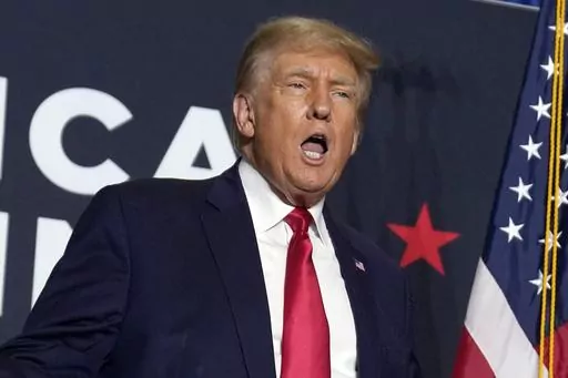 FILE — Former President Donald Trump speaks during a rally, Sept. 20, 2023, in Dubuque, Iowa. New York Judge Arthur Engoron, ruling in a civil lawsuit brought by New York Attorney General Letitia James, found that Trump and his company deceived banks, insurers and others by massively overvaluing his assets and exaggerating his net worth on paperwork used in making deals and securing loans. (AP Photo/Charlie Neibergall, File)