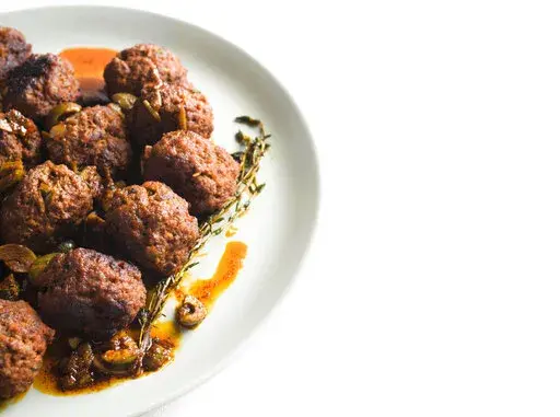 This image released by Milk Street shows a recipe for Spanish Meatballs. (Milk Street via AP)