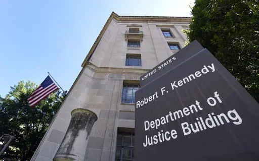 The view of the Justice Department in Washington, Thursday, Aug. 27, 2015. (AP Photo/Susan Walsh, File)