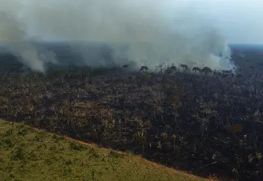 Smoke rises from a forest fire in the Transamazonica highway region, in the municipality of Labrea, Amazonas state, Brazil, Sept. 17, 2022. Deforestation in the Brazilian Amazon slowed slightly last year, a year after a 15-year high, according to closely watched numbers published Wednesday, Nov. 30. (AP Photo/Edmar Barros, File)