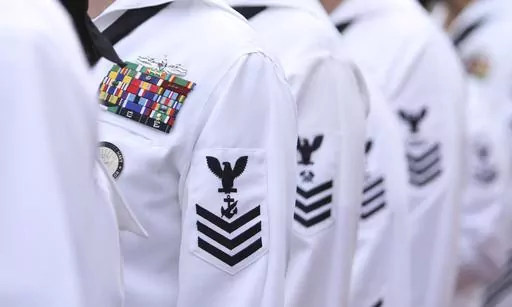 Enlisted sailors line up and wait to march on the field at Sun Life Stadium before the NFL football game in Miami, Nov. 13, 2011, between the Washington Redskins and Miami Dolphins. The Navy will begin randomly testing its special operations forces for steroids and other performance-enhancing drugs beginning in November, taking a groundbreaking step that military leaders have long resisted. Rear Adm. Keith Davids, commander of Naval Special Warfare Command, announced the new program Friday, Sept