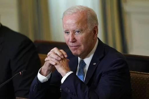 President Joe Biden waits for members of the press to leave after speaking at a meeting of the White House Competition Council in the State Dining Room of the White House in Washington, Monday, Sept. 26, 2022. (AP Photo/Susan Walsh)