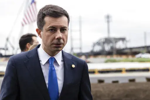 FILE -U.S. Department of Transportation Secretary Pete Buttigieg attends a groundbreaking ceremony for the New Portal North Bridge project held in Kearny, N.J., Monday, Aug 1, 2022. A group of environmental and racial justice organizations filed a lawsuit in federal court Thursday, Nov. 17, against the U.S. Department of Transportation and  Buttigieg. The lawsuit aims to halt a Gulf Coast road project that the group says will harm the environment near historic Black neighborhoods. (AP Photo/Stef