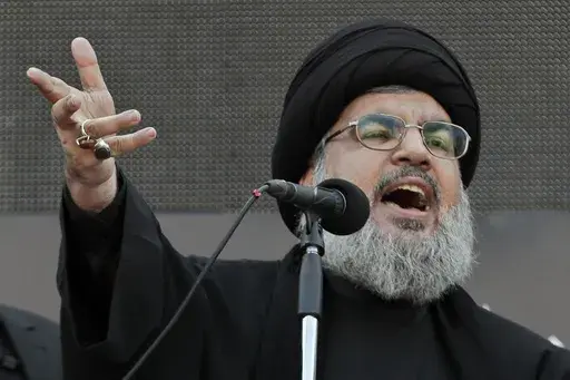 Hezbollah leader Sheik Hassan Nasrallah, speaks to the crowd in a rare public appearance during Ashura, that marks the death of Shiite Islam's Imam Hussein, in the suburbs of Beirut, Nov. 14, 2013. (AP Photo/Bilal Hussein, File)