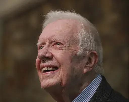 Former President Jimmy Carter smiles as he returns to Maranatha Baptist Church in Plains, Ga., to teach Sunday school, June 9, 2019, less than a month after falling and breaking his hip. (Curtis Compton/Atlanta Journal-Constitution via AP, File)
