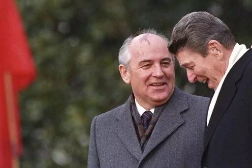 U.S. President Ronald Reagan, right, talks with Soviet leader Mikhail Gorbachev during arrival ceremonies at the White House where the superpowers begin their three-day summit talks in Washington, D.C., Tuesday, Dec. 8, 1987. Russian news agencies are reporting that former Soviet President Mikhail Gorbachev has died at 91. The Tass, RIA Novosti and Interfax news agencies cited the Central Clinical Hospital. (AP Photo/Boris Yurchenko, File)
