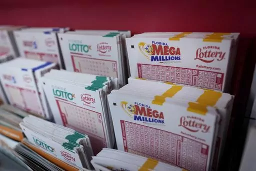 Lottery forms are seen, Aug. 7, 2023, at the Presidente Supermarket in the Little Havana neighborhood of Miami. Officials said on Wednesday, Sept. 27, that the winner of the $1.6 billion Mega Millions jackpot in August has come forward to claim the prize. The winning ticket was sold at a Publix supermarket in Neptune Beach, Fla., a town along the Atlantic Coast near Jacksonville, Fla. (AP Photo/Wilfredo Lee, File)