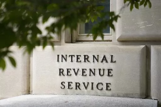 A sign outside the Internal Revenue Service building in Washington, on May 4, 2021. Effective immediately, the Internal Revenue Service will end its decades-old policy of making unannounced home and business visits — in a nod to worker safety and combatting scammers who pose as IRS agents. (AP Photo/Patrick Semansky, File)