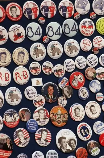 This photo shows buttons from the 1984 Reagan-Bush campaign. Reagan announced on Jan. 29, 1984. His approval rating was 52% that month. Despite concerns about his age — he was 73 and the oldest president in history at the time — Reagan handily defeated Walter Mondale, a Democrat. (AP Photo, File)