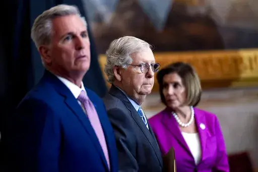 From left, House Minority Leader Kevin McCarthy of Calif., Senate Minority Leader Mitch McConnell of Ky., and House Speaker Nancy Pelosi of Calif., arrive for a ceremony in the Rotunda of the U.S. Capitol Building in Washington, Sept. 29, 2022. (AP Photo/Andrew Harnik, File)