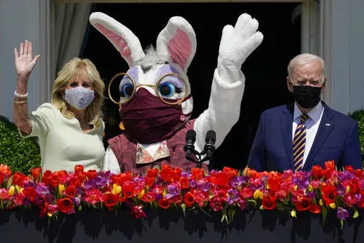 President Joe Biden appears with first lady Jill Biden and the Easter Bunny on the Blue Room balcony at the White House April 5, 2021, in Washington. The White House Easter Egg Roll is returning on April 18, 2022, after a 2-year, COVID-induced hiatus. The Biden's will welcome some 30,000 kids and their adult chaperones for the egg roll, an egg hunt and other activities. (AP Photo/Evan Vucci, File)