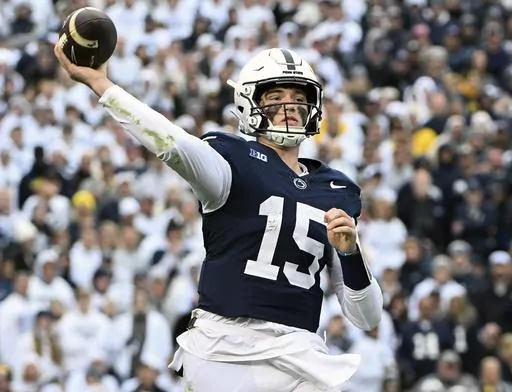 Penn State quarterback Drew Allar passes against Michigan during the second half of an NCAA college football game Nov. 11, 2023, in State College, Pa. Mississippi will play for the first 11-win season in school history when the Rebels of the Southeastern Conference, led by quarterback Jaxson Dart, face Penn State, led by Allar, in the Peach Bowl, Saturday, Dec. 30, 2023. (AP Photo/Barry Reeger, File)