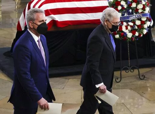 House Minority Leader Kevin McCarthy of Calif. and Senate Minority Leader Mitch McConnell of Ky., right, pay their respects to former Senate Majority Leader Harry Reid, D-Nev., during a memorial service in the Rotunda of the U.S. Capitol as Reid lies in state, Wednesday, Jan. 12, 2022, in Washington.  (Evelyn Hockstein/Pool via AP)
