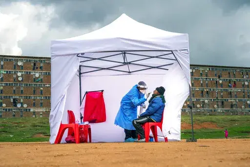 A resident from the Alexandra township gets tested for COVID-19 in Johannesburg, South Africa, Wednesday, April 29, 2020. In a new analysis released Thursday, April 7, 2022, the U.N. health agency reviewed 151 studies of COVID-19 in Africa based on blood samples taken from people on the continent between January 2020 and December 2021. WHO said that by last September, about 65% of people tested had some exposure to COVID-19, translating into about 800 million infections. In contrast, by that tim