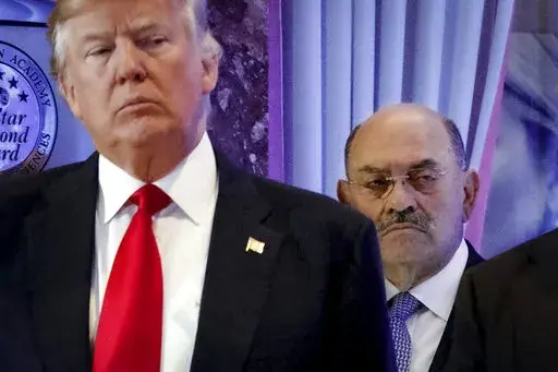 Allen Weisselberg, right, stands behind then President-elect Donald Trump during a news conference in the lobby of Trump Tower in New York, Jan. 11, 2017. Weisselberg, Trump's chief financial officer, is expected to plead guilty on Thursday, Aug. 18, 2022 to tax violations in a deal that would require him to testify about business practices at the former president's company. (AP Photo/Evan Vucci, File)