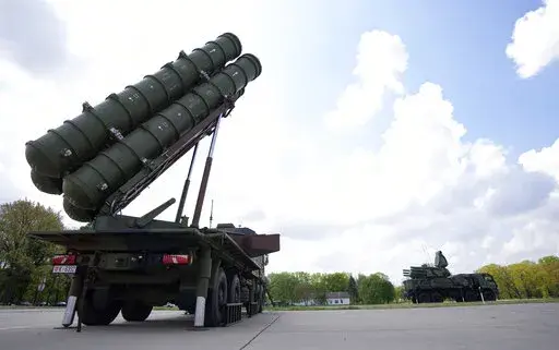 HQ-22 anti-aircraft systems, whose export version is known as FK-3, left, during the military exercises on Batajnica, military airport near Belgrade, Serbia, Saturday, April 30, 2022. Serbia on Saturday publicly displayed a recently delivered Chinese anti-aircraft missile system, raising concerns in the West and among some of Serbia's neighbors that an arms buildup in the Balkans could threaten fragile peace in the region. (AP Photo/Darko Vojinovic)