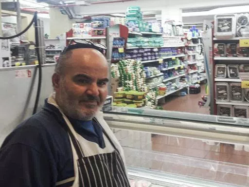 This 2021 photo provided by Haim Parag shows David Ben-Avraham at a supermarket in the Israeli town of Beit Shamesh, where he briefly worked, in Jerusalem. Ben-Avraham, a Palestinian who was born a Muslim but made the almost unheard-of decision to convert to Judaism years earlier, was fatally shot by an Israeli soldier. (Courtesy of Haim Parag via AP)