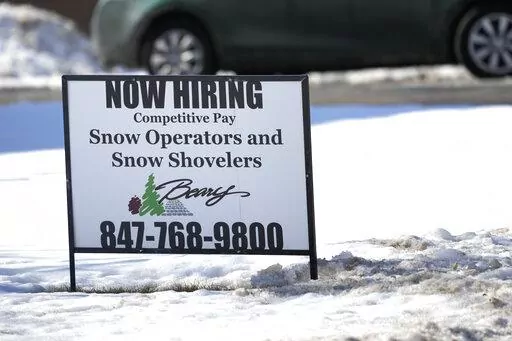 A hiring sign is displayed in Arlington Heights, Ill., Sunday, Feb. 5, 2022. On Thursday, the Labor Department reports on the number of people who applied for unemployment benefits last week. (AP Photo/Nam Y. Huh)