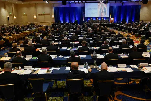 Clergy attend the Fall General Assembly meeting of the United States Conference of Catholic Bishops, Wednesday, Nov. 17, 2021, in Baltimore.(AP Photo/Julio Cortez)