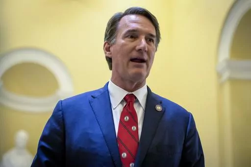 Virginia Gov. Glenn Youngkin speaks to members of the press inside the Rotunda of the state Capitol building on Feb. 25, 2023, in Richmond, Va. In two years as Virginia's governor, Republican Glenn Youngkin has gone from political newcomer to potential 2024 presidential candidate. (AP Photo/John C. Clark, File)