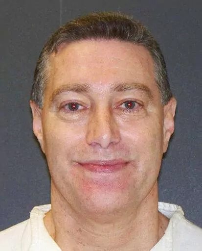 This booking photo provided by the Texas Department of Criminal Justice shows Robert Fratta, a former suburban Houston police officer on death row. Fratta was set to be executed on Tuesday, Jan. 10, 2023, for hiring two people to kill his estranged wife nearly 30 years ago. (Texas Department of Criminal Justice via AP, File)