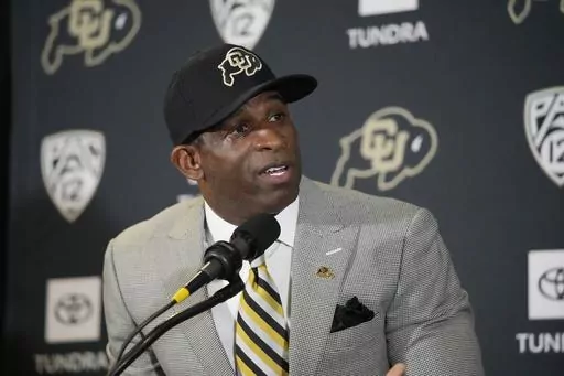 Deion Sanders speaks after being introduced as the new head football coach at the University of Colorado during a news conference Sunday, Dec. 4, 2022, in Boulder, Colo. The spring transfer window for college football players closed with 43 scholarship players -- the equivalent of half a roster -- from coach Deion Sanders' Colorado program having entered the portal since the spring game was played on April 15. (AP Photo/David Zalubowski, File)