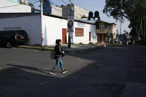 Domestic worker Concepcion Alejo heads to her workplace, in Mexico City, Wednesday, April 24, 2024. Alejo is among approximately 2.5 million Mexicans — largely women — who serve as domestic workers in the Latin American nation. (AP Photo/Marco Ugarte)