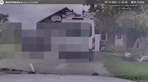 This still image from Sagadahoc County Sheriff’s Office shows dash camera video from Sept. 16, 2023 as police approach Robert Card's father's house. Police feared confronting the Army reservist prior to the worst mass shooting in state history would “throw a stick of dynamite on a pool of gas,” according to footage released by law enforcement. The videos were released to the Portland Press Herald and then sent to The Associated Press on Friday, Dec. 22. (Sagadahog County Sheriff's office/P