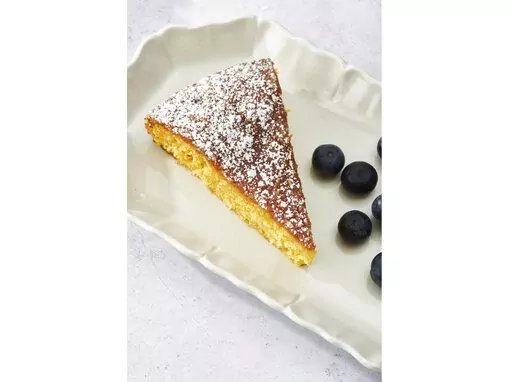 This May 2022 photo shows a recipe for orange cake. The zest and the juice are the two main ways to incorporate citrus into your cooking. (Cheyenne Cohen via AP)