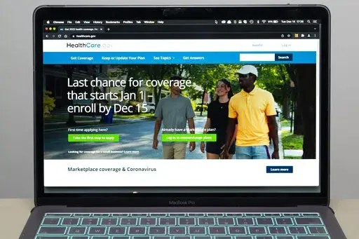 The healthcare.gov website is seen, on Dec. 14, 2021 in Fort Washington, Md. People looking for health insurance in the midst of the omicron surge have through Saturday to sign up for taxpayer-subsidized private coverage under the Obama-era Affordable Care Act. (AP Photo/Alex Brandon, File)