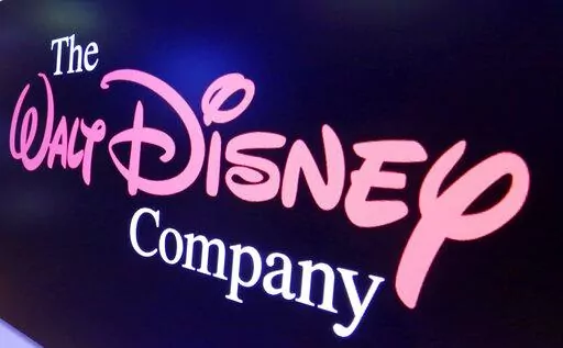 The Walt Disney Co. logo appears on a screen above the floor of the New York Stock Exchange, Aug. 7, 2017, in New York. The Walt Disney Co.'s public opposition to a Florida bill banning instruction on sexual orientation and gender identity in kindergarten through third grade has led to a range of social media posts attempting to malign the company, falsely claiming it is sympathetic to pedophiles or predatory toward young children. (AP Photo/Richard Drew, File)