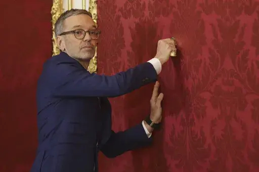 Austria's Freedom Party leader Herbert Kickl leaves the presidential office, in Vienna, Austria, Monday, Jan. 06, 2025. (AP Photo/Heinz-Peter Bader)