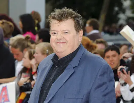 Robbie Coltrane arrives in Trafalgar Square, central London, for the world premiere of "Harry Potter and The Deathly Hallows: Part 2," the last film in the series on July 7, 2011. Coltrane, who played a forensic psychologist on TV series “Cracker” and Hagrid in the “Harry Potter” movies, has died. Coltrane’s agent Belinda Wright said he died Friday at a hospital in Scotland. He was 72. (AP Photo/Jonathan Short, File)