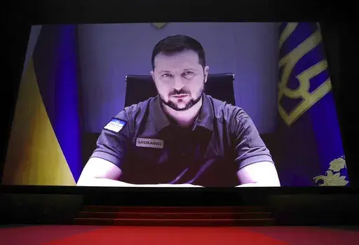 President of Ukraine Volodymyr Zelenskyy appears via remote during the opening ceremony of the 75th international film festival, Cannes, southern France, Tuesday, May 17, 2022. (Photo by Vianney Le Caer/Invision/AP)