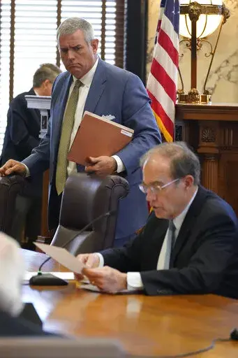 House Speaker Philip Gunn, R-Clinton, left, listens as Lt. Gov. Delbert Hosemann closes a meeting of the Joint Legislative Budget Committee, Friday, March 25, 2022 at the Mississippi Capitol in Jackson, Miss. (AP Photo/Rogelio V. Solis)