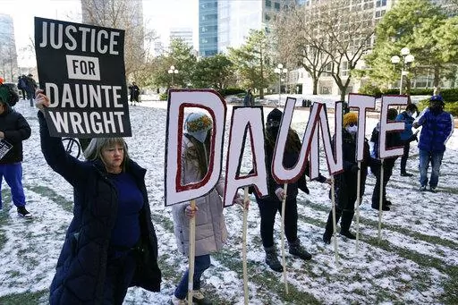 Demonstrators gather at the Hennepin County Government Center in Minneapolis where jurors found former suburban Minneapolis police officer Kim Potter guilty of first degree and second degree manslaughter in the death of motorist Daunte Wright on Dec. 23, 2021. Few Americans believe there has been significant progress over the last 50 years in achieving equal treatment for Black people in dealings with police and the criminal justice system. That's according to a new poll by The Associated Press-