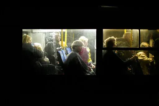 People who fled from Mariupol, a few of them from the Azovstal steel plant, arrive by bus to a reception center for displaced people in Zaporizhzhia, Ukraine, Sunday, May 8, 2022. Thousands of Ukrainian continue to leave Russian occupied areas. (AP Photo/Francisco Seco)