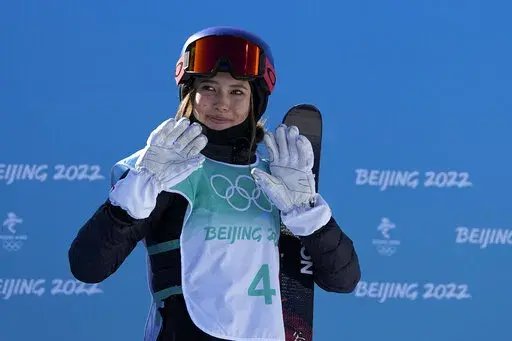 Eileen Gu, of China, waves after competing during the women's freestyle skiing big air finals of the 2022 Winter Olympics, Feb. 8, 2022, in Beijing. (AP Photo/Jae C. Hong, File)