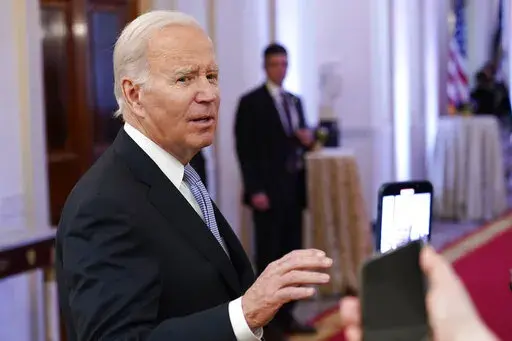 President Joe Biden talks with reporters after speaking in the East Room of the White House in Washington, Jan 20, 2023. Senior Democratic lawmakers turned sharply more critical Sunday of President Joe Biden's handling of classified materials after the FBI discovered additional items with classified markings at Biden's home. (AP Photo/Susan Walsh, File)