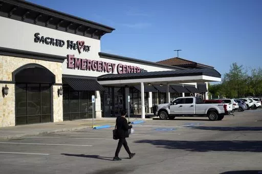 Sacred Heart Emergency Center is pictured Friday, March 29, 2024, in Houston. Complaints about pregnant women being turned away from emergency rooms spiked in the months after states began enacting strict abortion laws following the 2022 U.S. Supreme Court decision overturning Roe v. Wade. At Sacred Heart Emergency Center in Houston, front desk staff refused to check-in one woman after her husband asked for help delivering her baby. She miscarried in a restroom toilet in the emergency room lobby