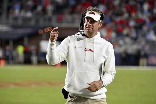 FILE -Mississippi head coach Lane Kiffin gestures during the second half of an NCAA college football game against Arkansas in Oxford, Miss., Saturday, Oct. 7, 2023. A lawsuit accusing Mississippi football coach Lane Kiffin of racial and sexual discrimination and negligence was dismissed Wednesday, Jan. 31, 2024. (AP Photo/Thomas Graning, File)