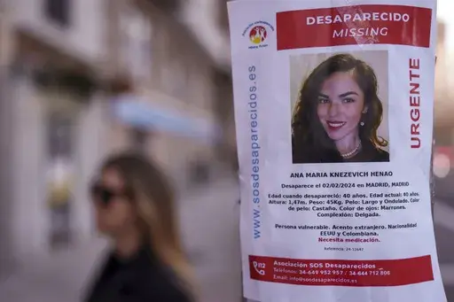 A missing poster for Colombian-born, American Ana Maria Knezevich Henao is displayed on a streetlight in Madrid, Spain, on Feb. 16, 2024. (AP Photo/Manu Fernandez, File)