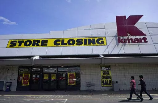 People walk into a Kmart in Avenel, N.J., Monday, April 4, 2022. When the New Jersey store closes its doors on April 16, it will leave only three remaining U.S. locations for the former retail powerhouse. It's a far cry from the chain's heyday in the 1980s and ‘90s when it had more than 2,000 stores and sold product lines endorsed by Martha Stewart and former “Charlie's Angel” Jaclyn Smith. (AP Photo/Seth Wenig)