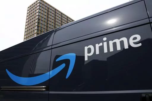 An Amazon Prime delivery vehicle is seen in downtown Pittsburgh on March 18, 2020. The Federal Trade Commission sued Amazon on Wednesday for what it called a years-long effort to enroll consumers without consent into its Prime program and making it difficult for them to cancel their subscriptions. (AP Photo/Gene J. Puskar, File)