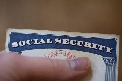 A Social Security card is displayed on Oct. 12, 2021, in Tigard, Ore. Most U.S. adults are opposed to proposals that would cut into Medicare or Social Security benefits, and a majority support raising taxes on the nation's highest earners to keep Medicare running as is. The new findings, revealed in a March poll by The Associated Press-NORC Center for Public Affairs Research, come as both safety net programs are poised to run out of enough cash to pay out full benefits within the next decade. (A