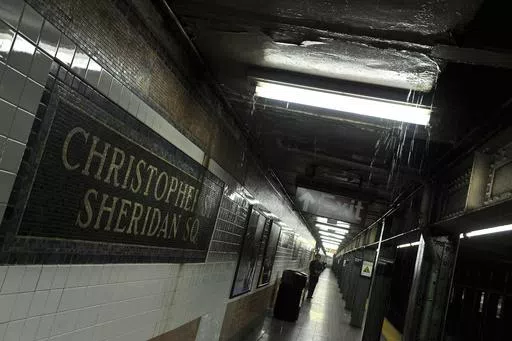 Rainwater seeps down into the Christopher Street-Sheridan Square subway station, March 30, 2010, in New York. The New York City subway station would be renamed to commemorate the Stonewall Inn protests that galvanized the modern LGBTQ rights movement, under legislation approved by state lawmakers as they wrapped up their session in June 2024. (AP Photo/Stephen Chernin, File)