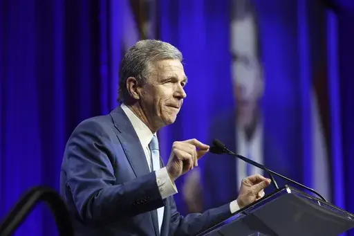 N.C. Gov. Roy Cooper speaks at the North Carolina Democratic Unity Dinner fundraiser in Raleigh, N.C., Saturday, July 20, 2024. (AP Photo/Karl B DeBlaker)